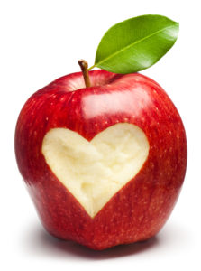 A red apple with a heart inside of it